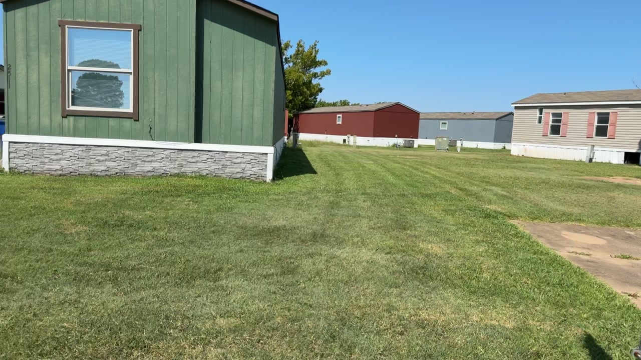 Freshly mowed lawn between homes