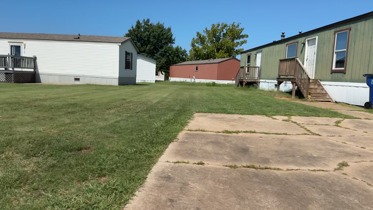 Mowed yard and driveway after a cut