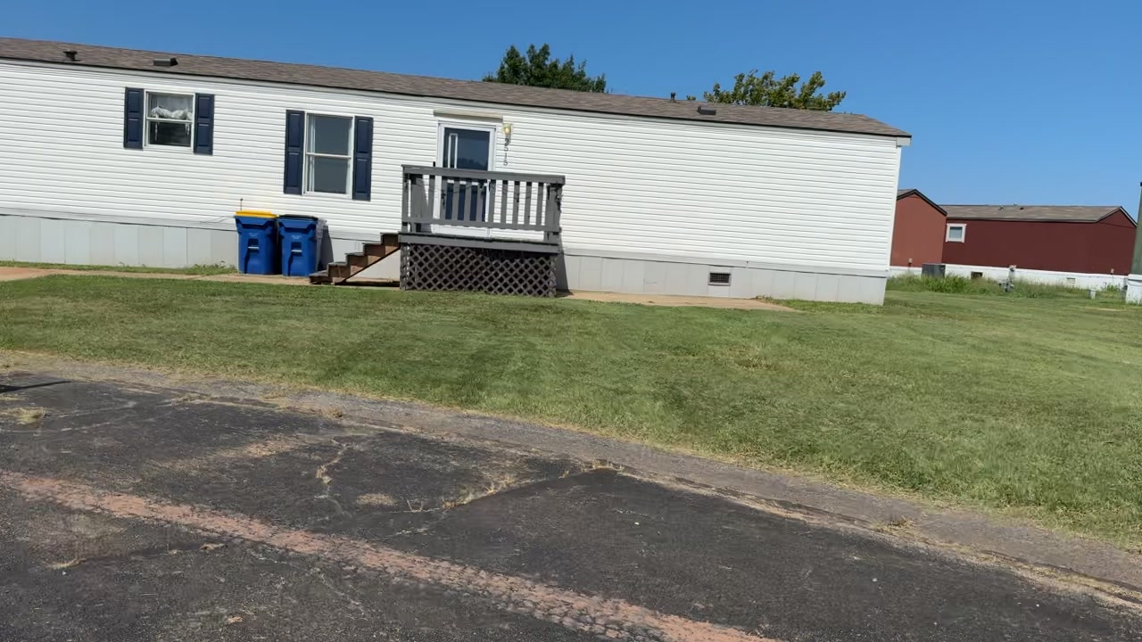 Cleanly cut lawn alongside a driveway