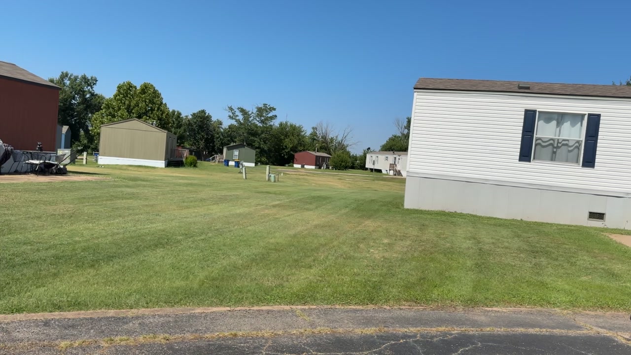 Wide mowed lot on a sunny day